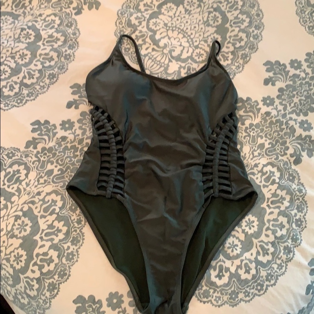 Green one piece bathing suit.
